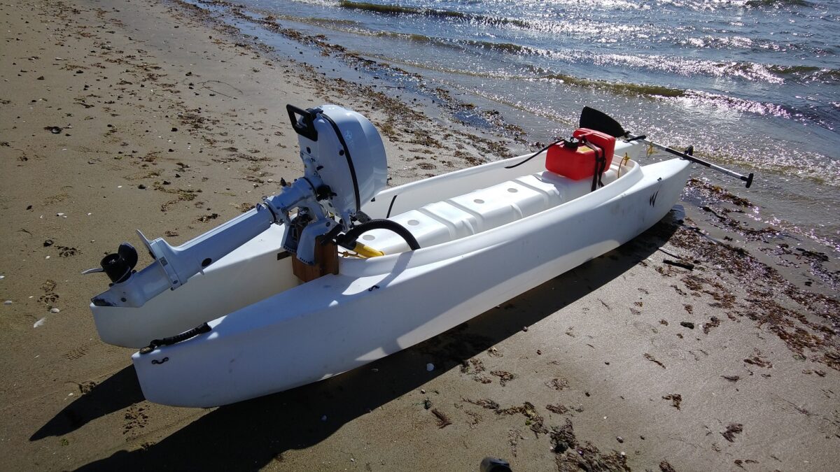 W720 kayak skiff with 6 HP motor and front mounted fuel tank
